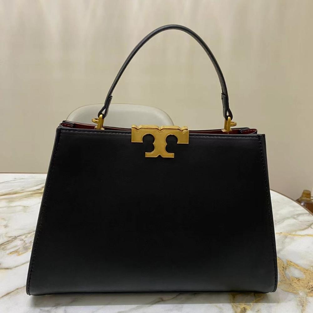 Barely handled, in near-new condition. Tory Burch